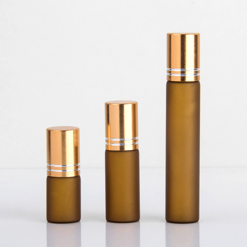 Amber frosted glass roll on bottles with gold cap