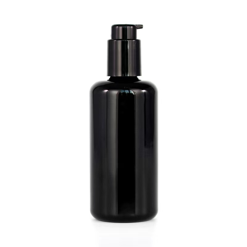 Dark violet glass cosmetic bottle with dropper cap