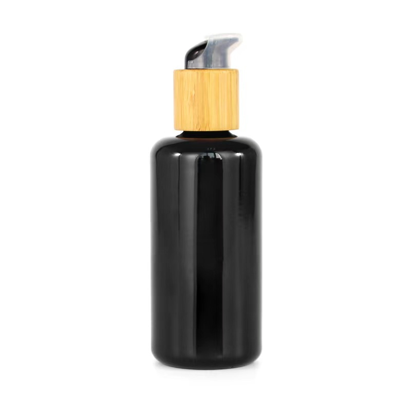 100ml dark violet glass bottle with bamboo pump title=